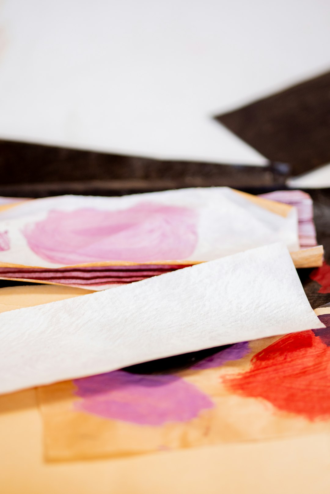 white printer paper on brown wooden table