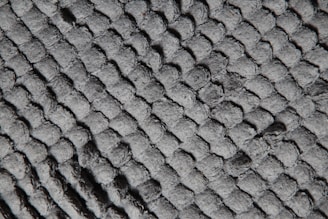 Close-up of huggedby fabric texture showing softness and quality stitching.