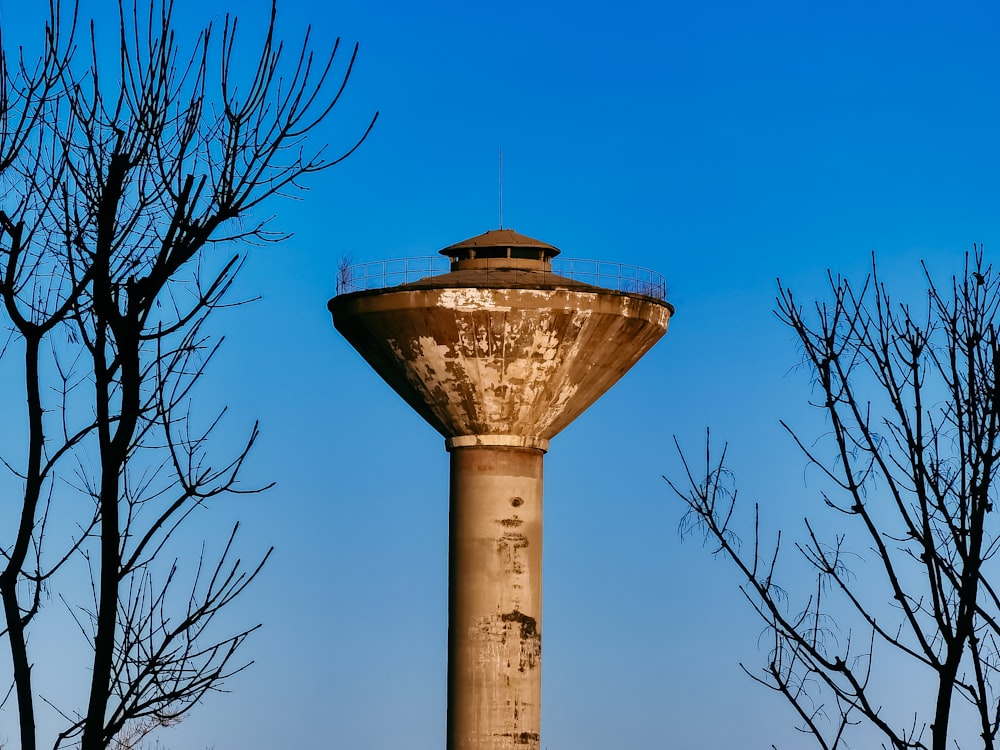 brown and white concrete building under blue sky during daytime