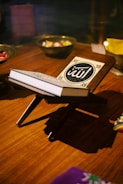 Close-up of a handcrafted wooden bookstand holding an open book.