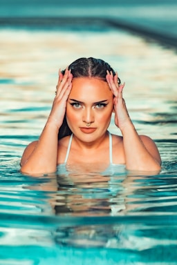 woman in white bikini top on water