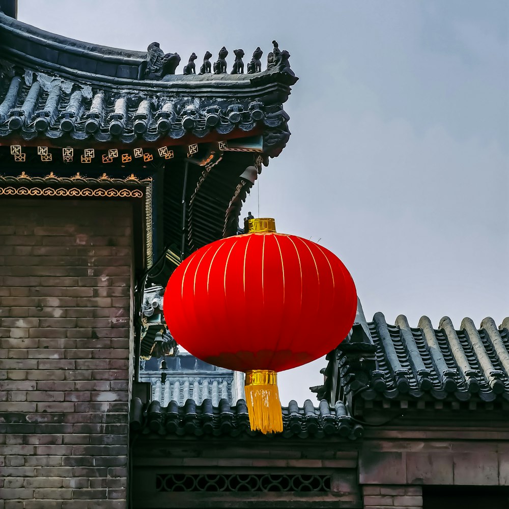 red balloon on top of building