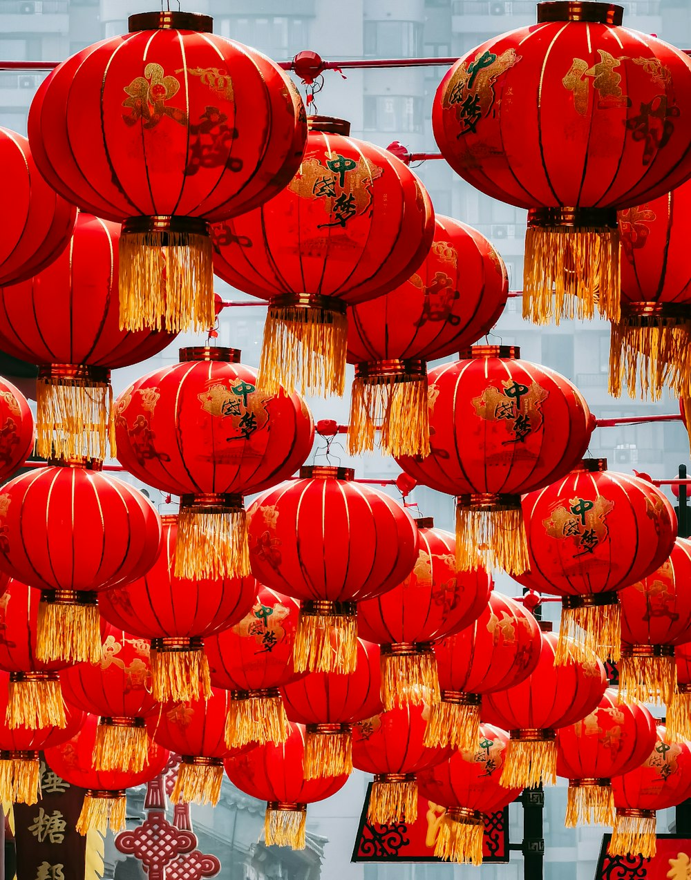 red paper lanterns on brown wooden wall