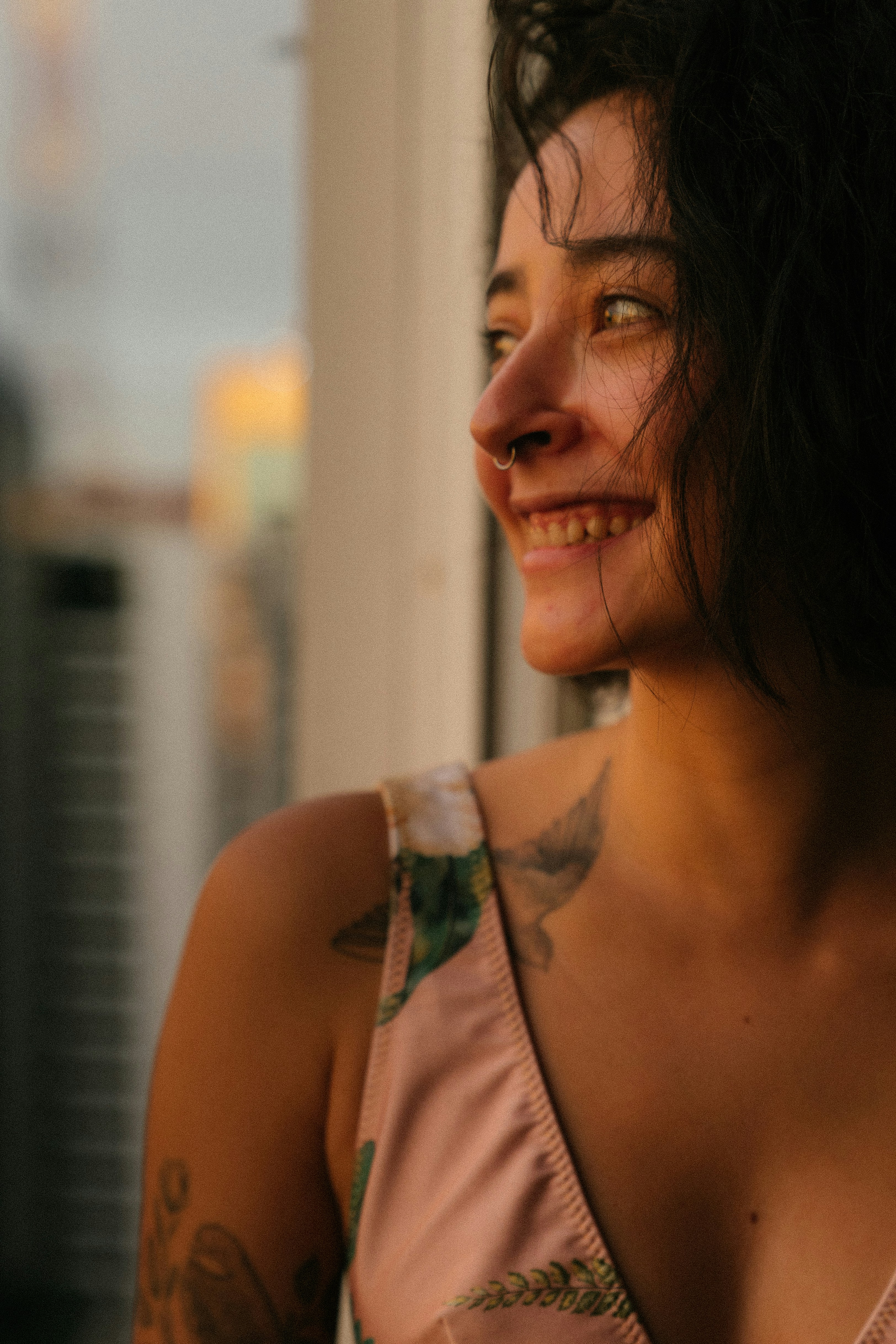 woman in white tank top smiling