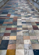 Finished pathway paved with durable, eco-friendly fly ash tiles under sunlight.