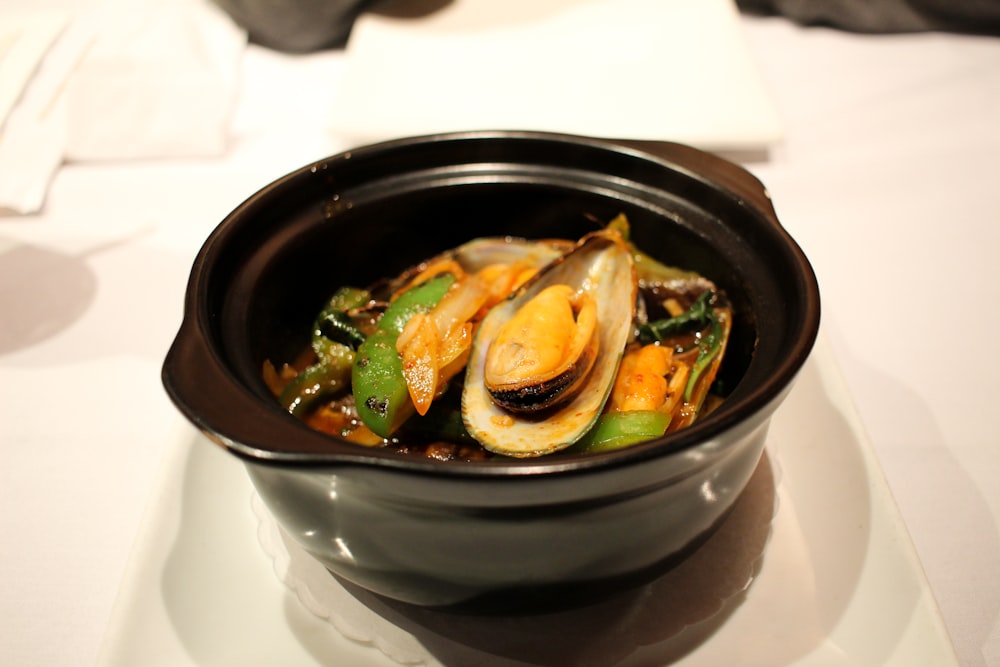 black ceramic bowl with soup