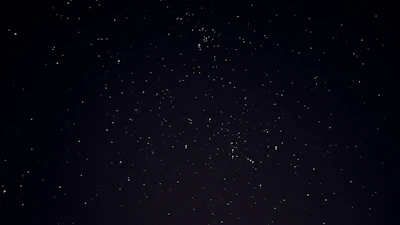 A serene night sky with constellations forming tarot symbols.