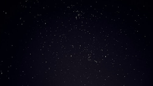 A peaceful night sky filled with stars, symbolizing the cosmos the astrologer reads.