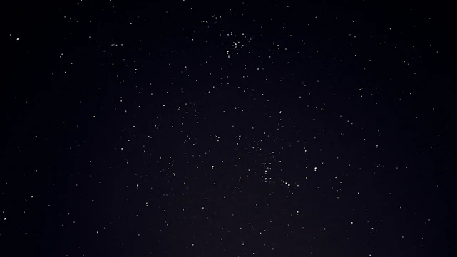 A serene night sky with constellations forming a family and couple figures, symbolizing connection through astrology.