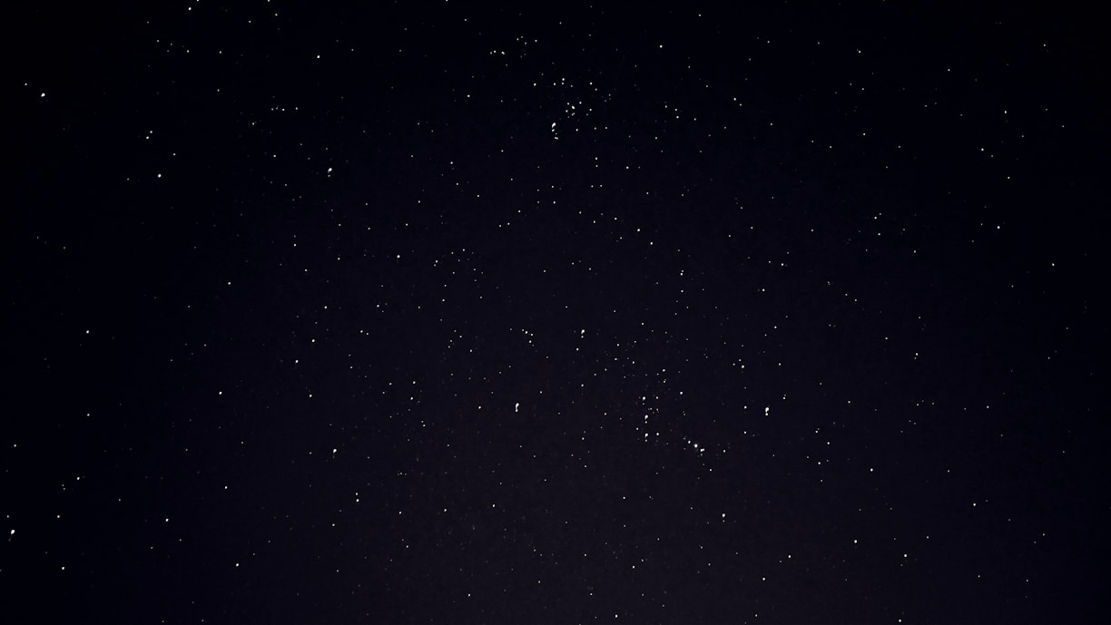 A serene image of a cosmic night sky with stars.