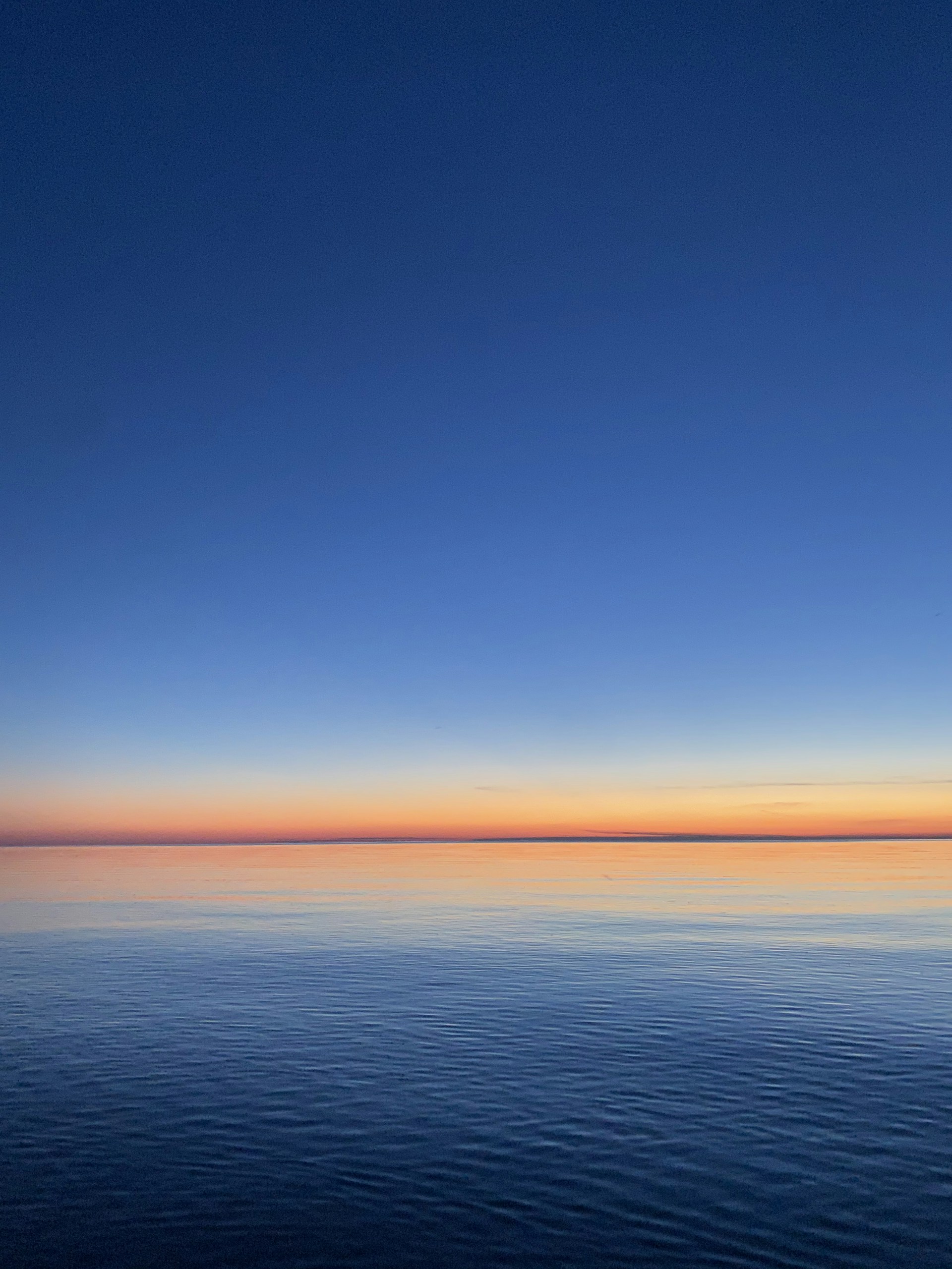 blue sea under blue sky during daytime