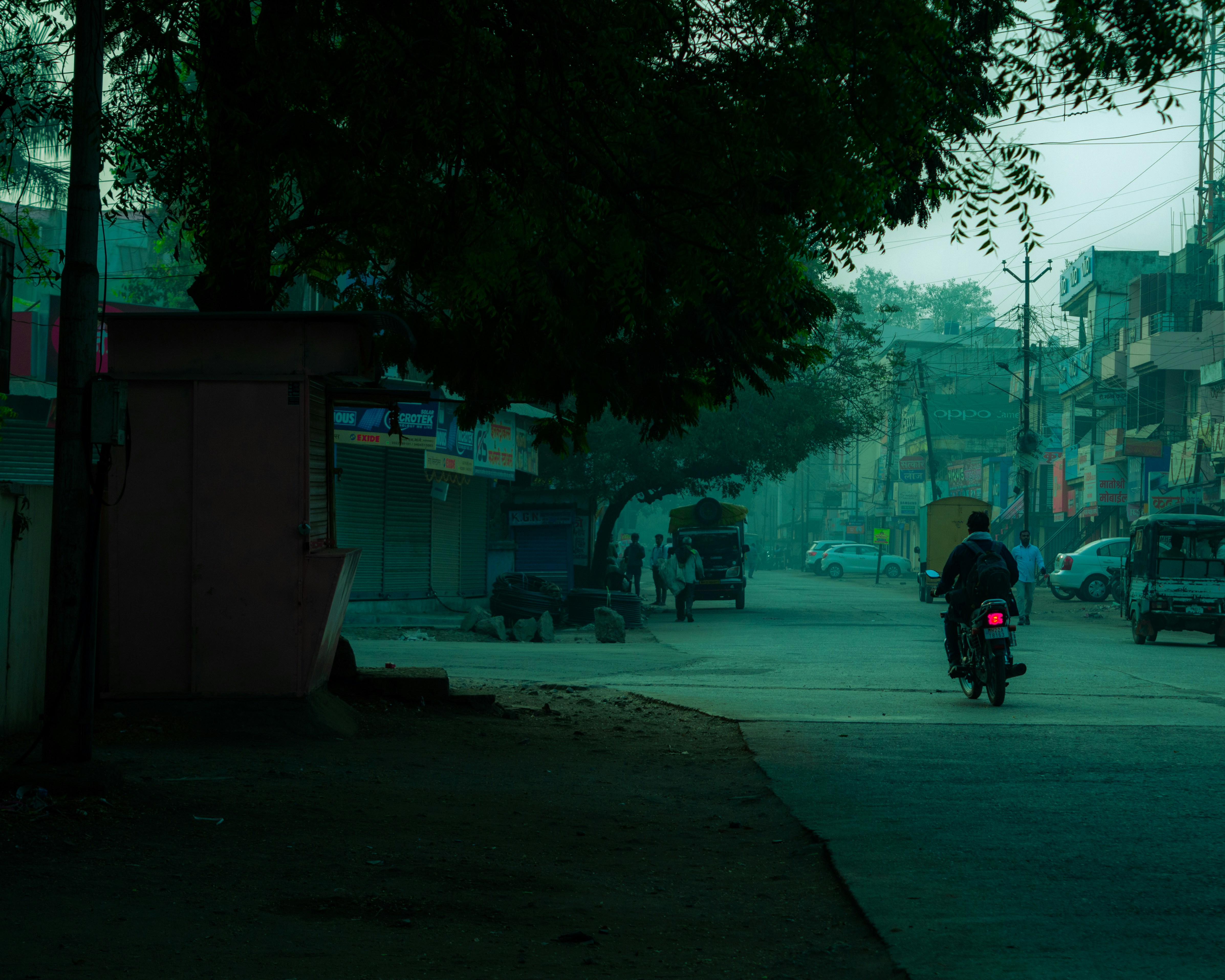 man in black jacket and black pants riding on motorcycle on road during nighttime