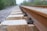 A close-up of precision-engineered train wheels on a railway track.