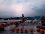 Peaceful view of Narmada river beside Omkareshwar temple at dawn.