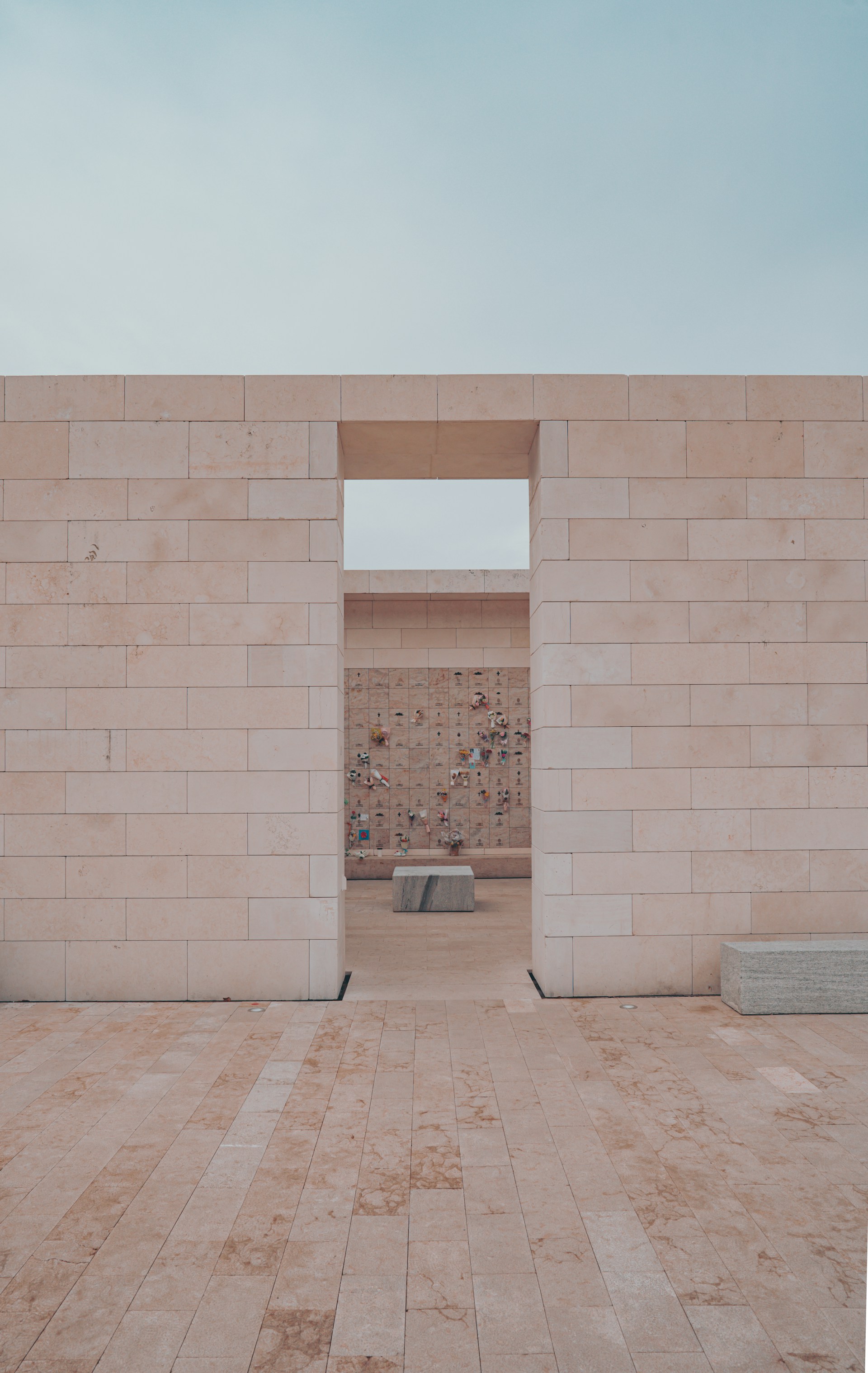 brown brick wall with white wooden door
