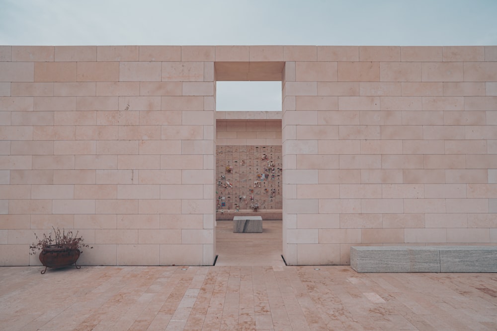 white concrete wall with brown wooden door