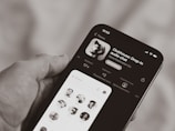 person holding black iphone 4