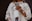 woman in white coat holding silver iphone 6