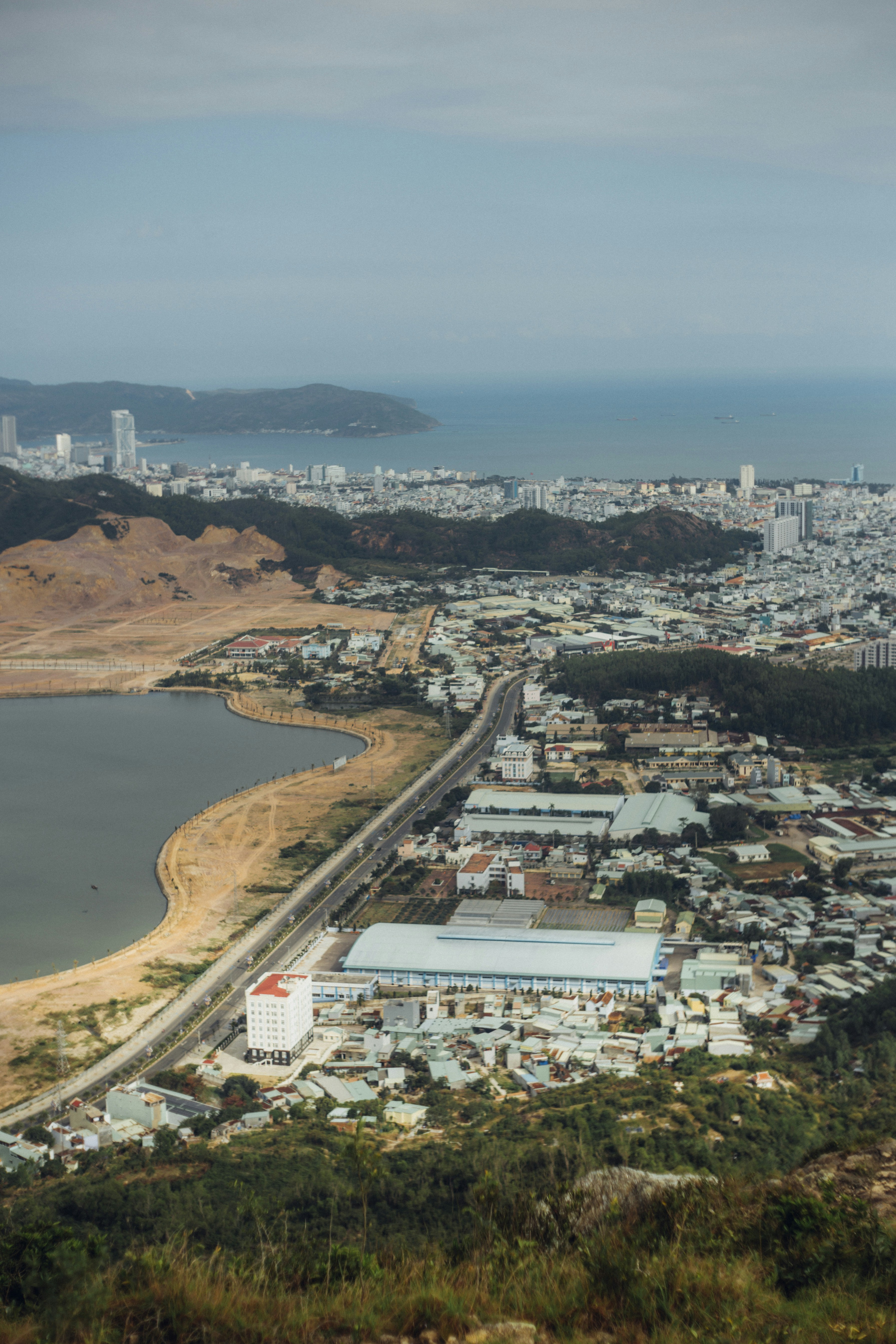 aerial view of city near body of water during daytime