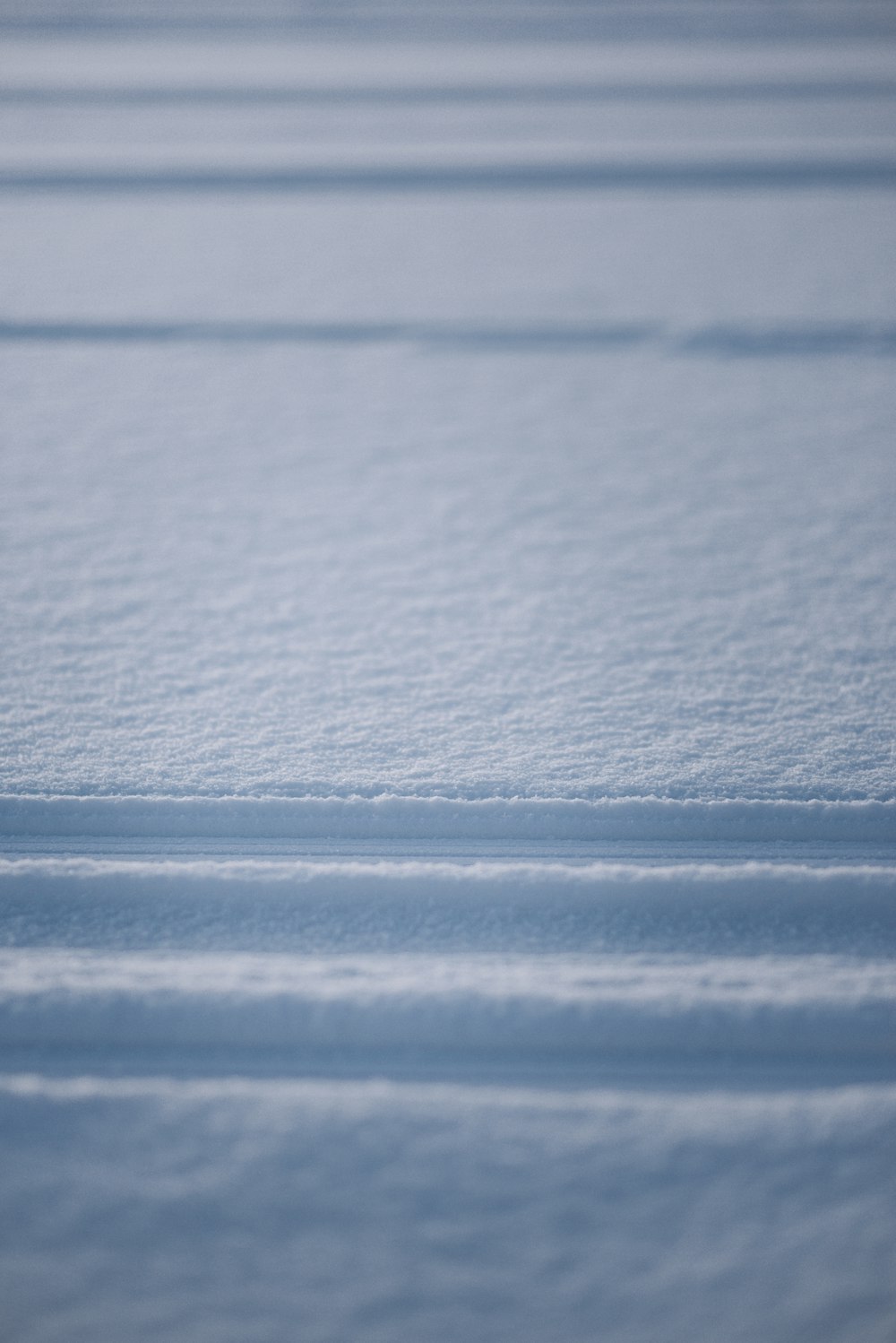 white snow on black surface