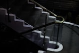 Brightly lit staircase featuring a sleek new handrail