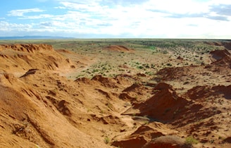 brown rocky mountain under blue sky during daytime