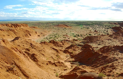 brown rocky mountain under blue sky during daytime