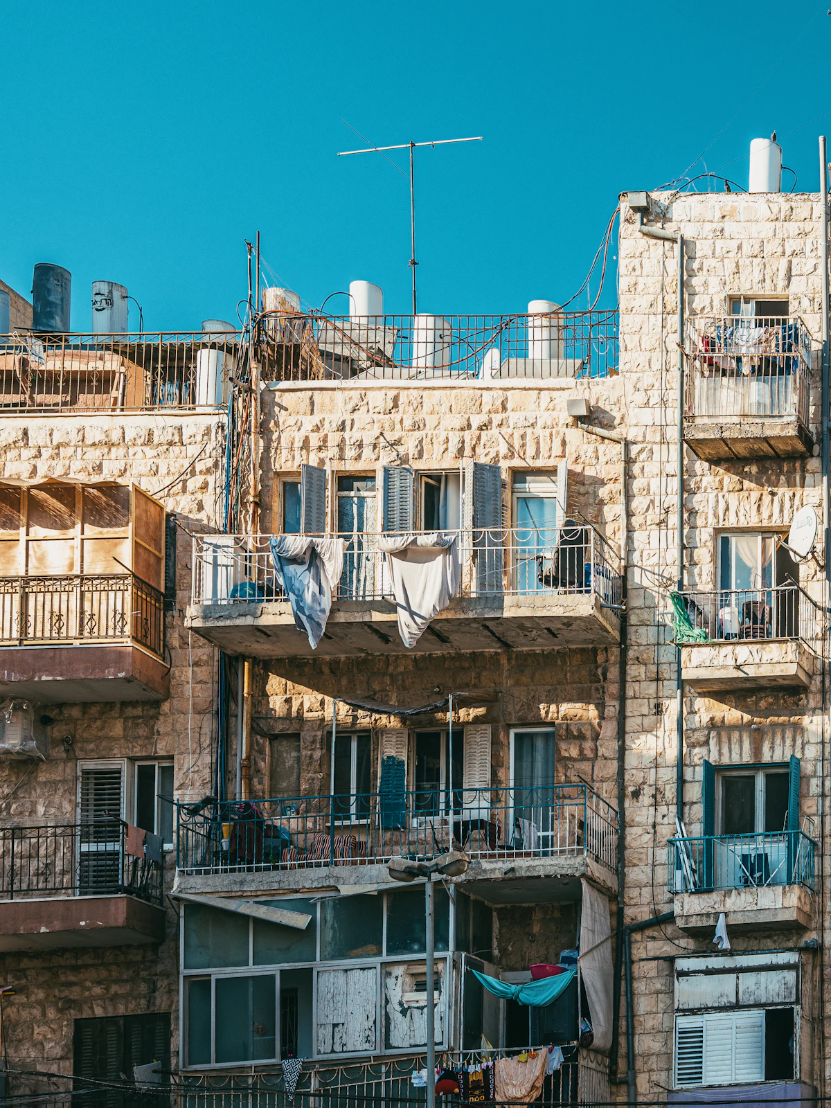 A Jerusalem stone apartment building with balconies