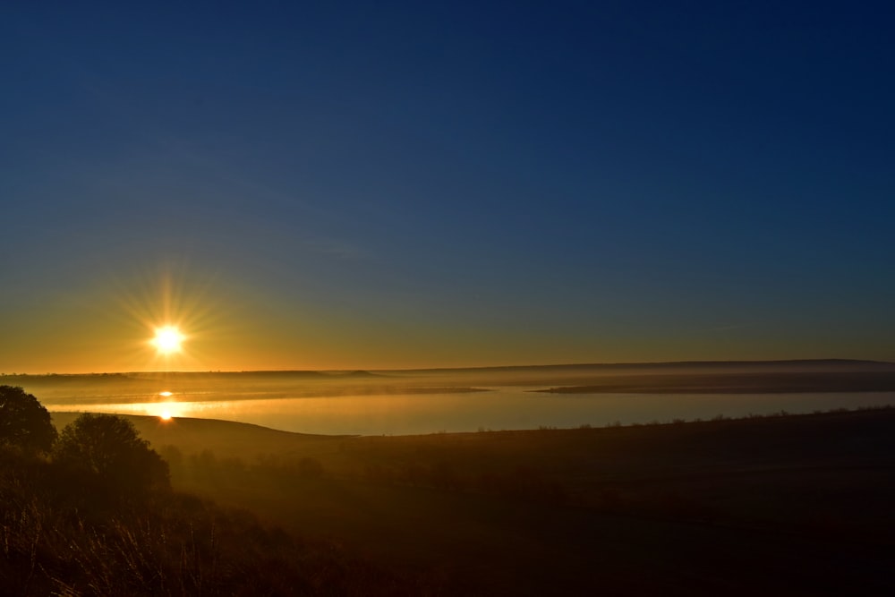 sun setting over the mountains