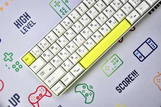 yellow and white keyboard on blue and white surface