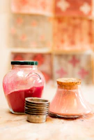 Brightly colored liquid gelatin packets arranged neatly on a wooden table.