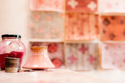 Colorful jars of fluffy slime with playful textures under soft natural light.