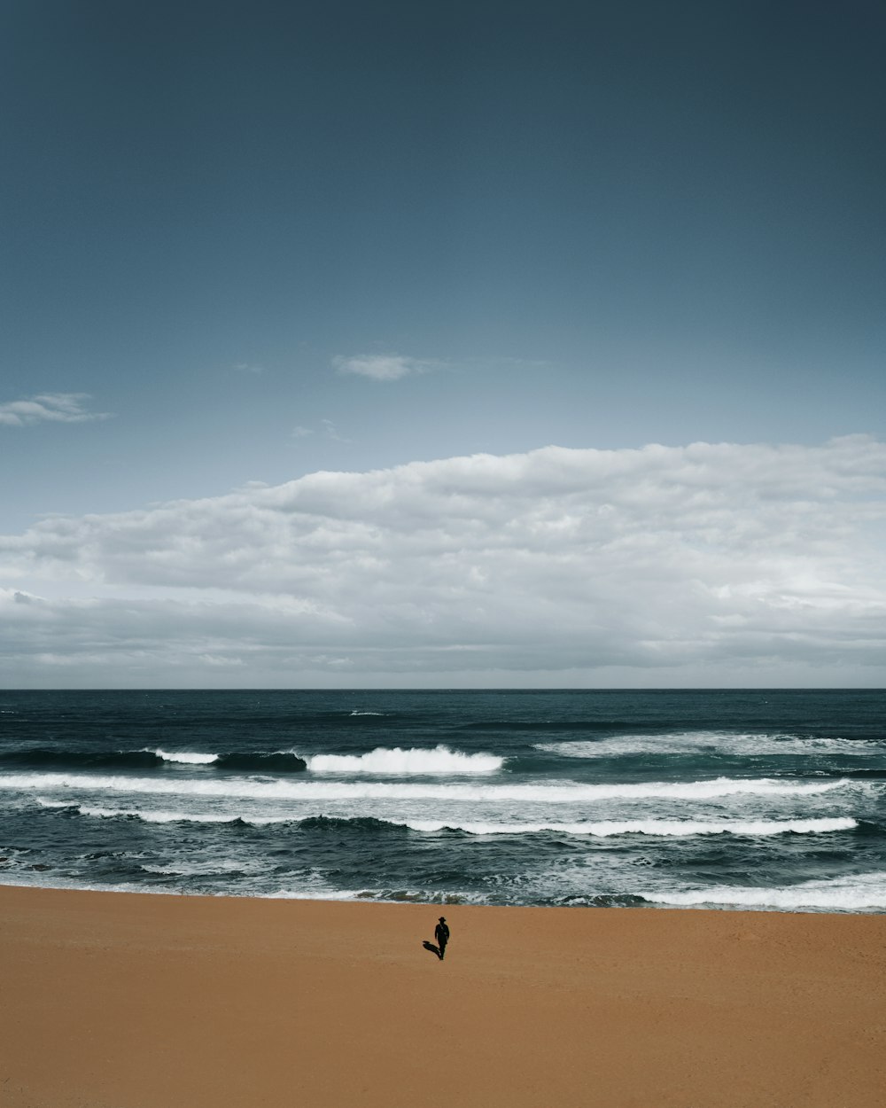 person surfing on sea waves during daytime