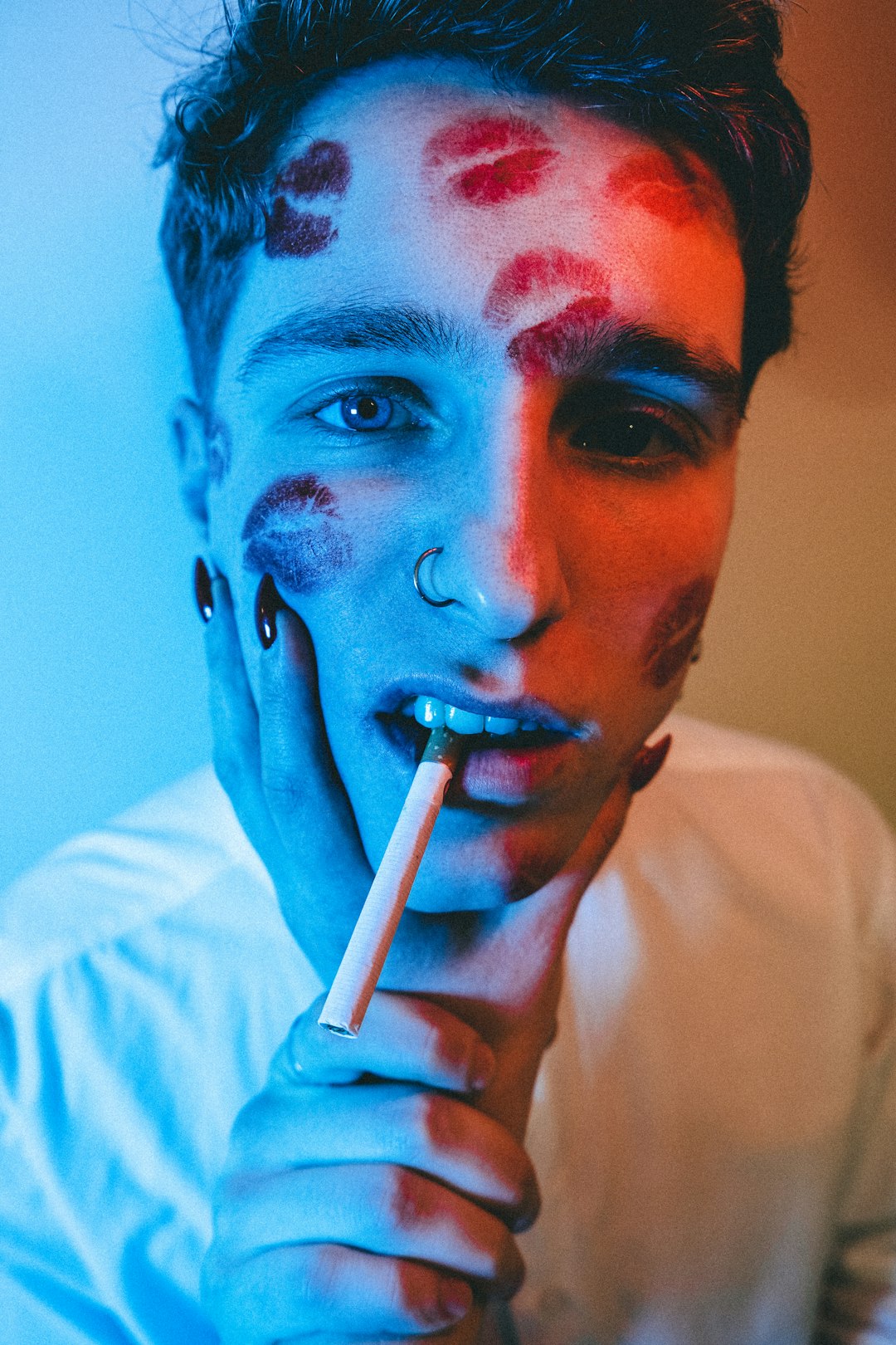 man in white shirt smoking