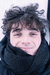 woman in black scarf smiling