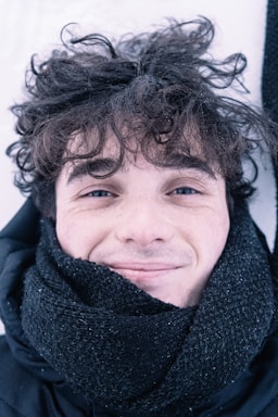 woman in black scarf smiling