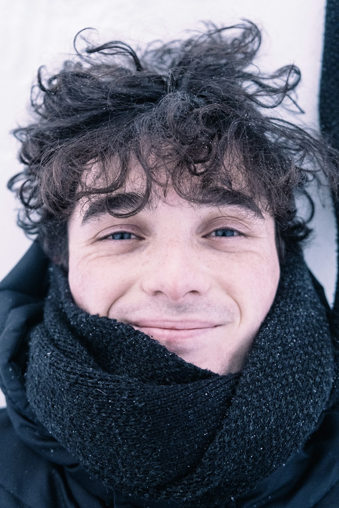 woman in black scarf smiling