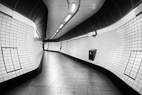 white and black hallway with white wall