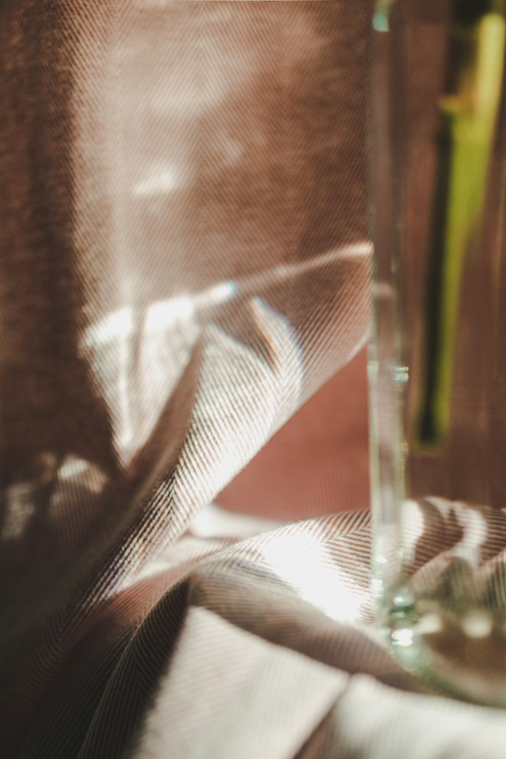 clear drinking glass on brown wooden table