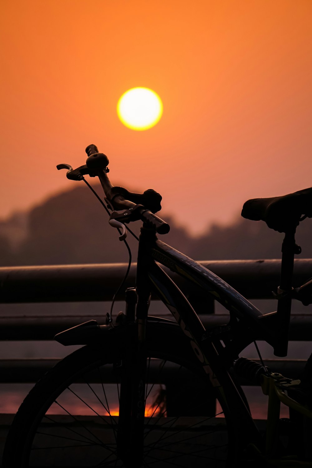 black bicycle during golden hour