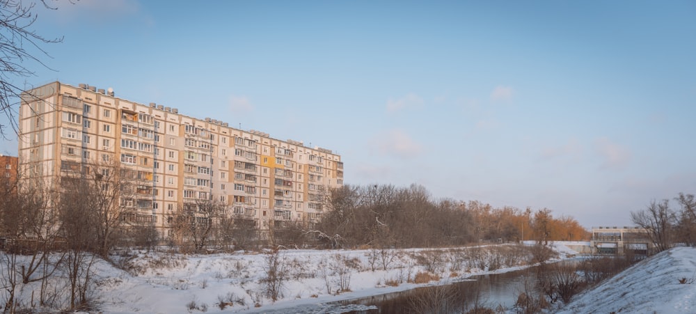 brown concrete building near trees during daytime