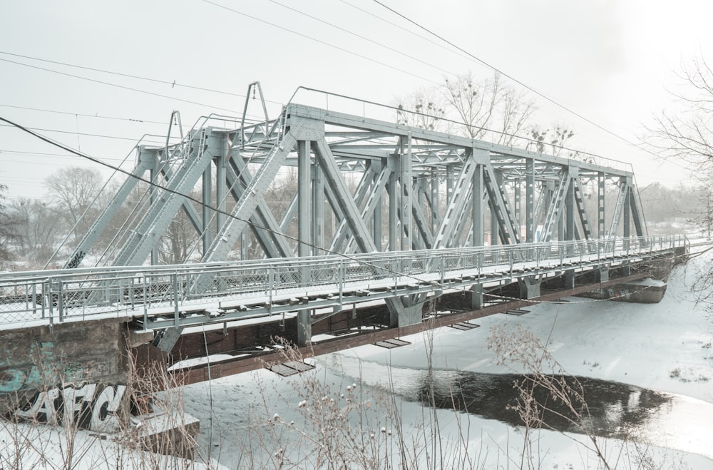 green metal bridge over river