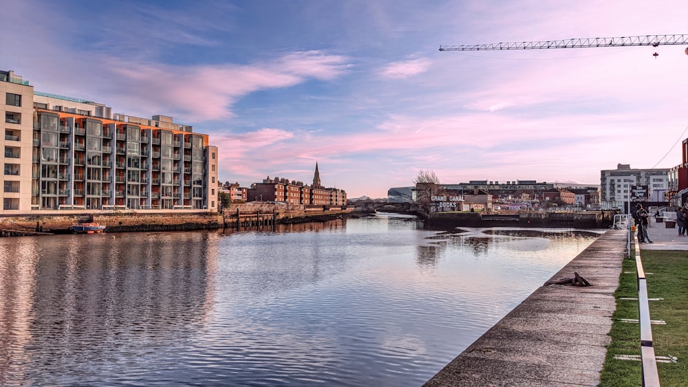 body of water near buildings during daytime