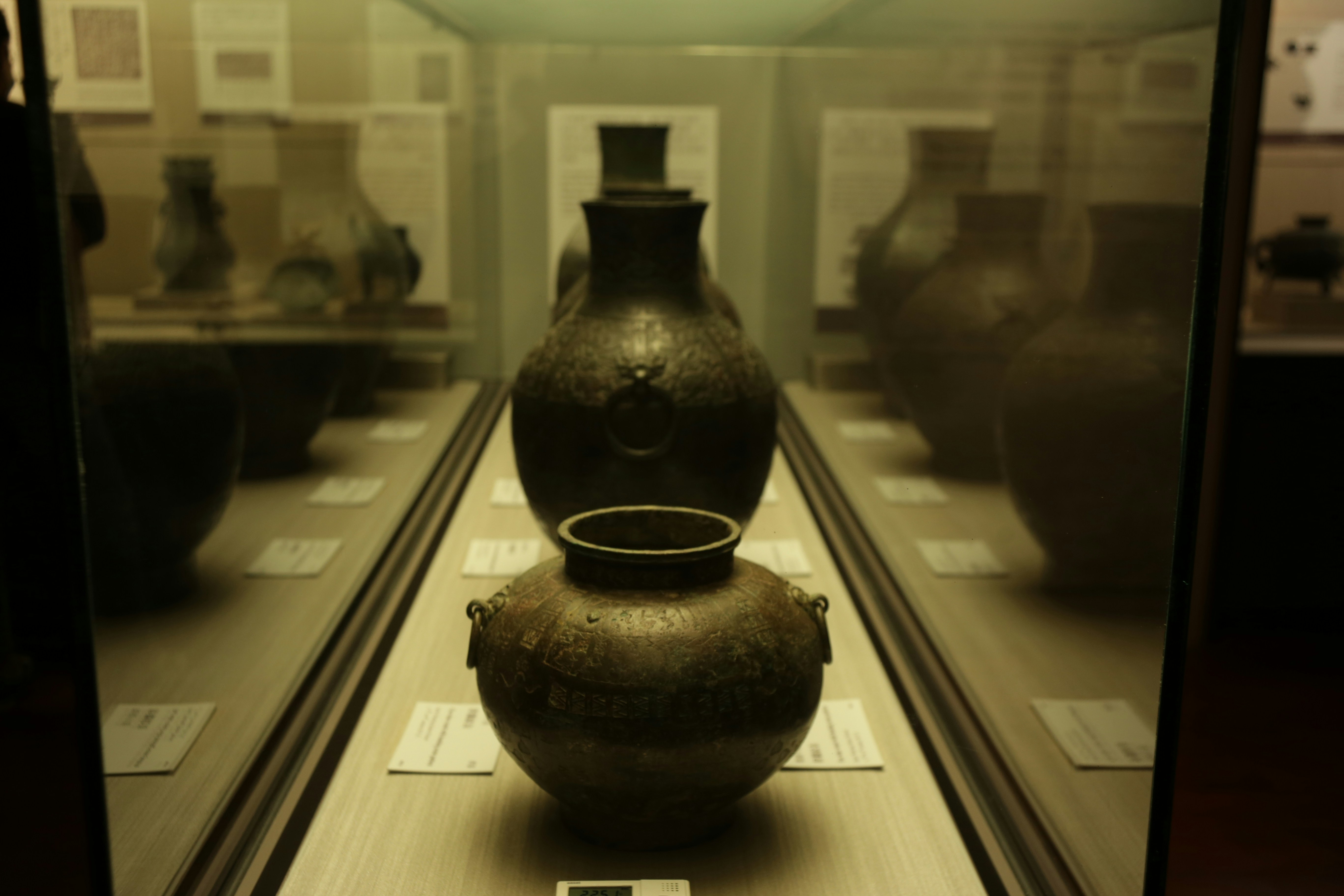 black ceramic vase on white wooden table