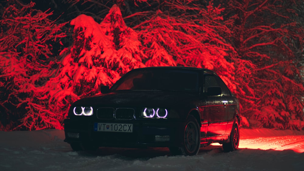 black bmw m 3 on snow covered ground