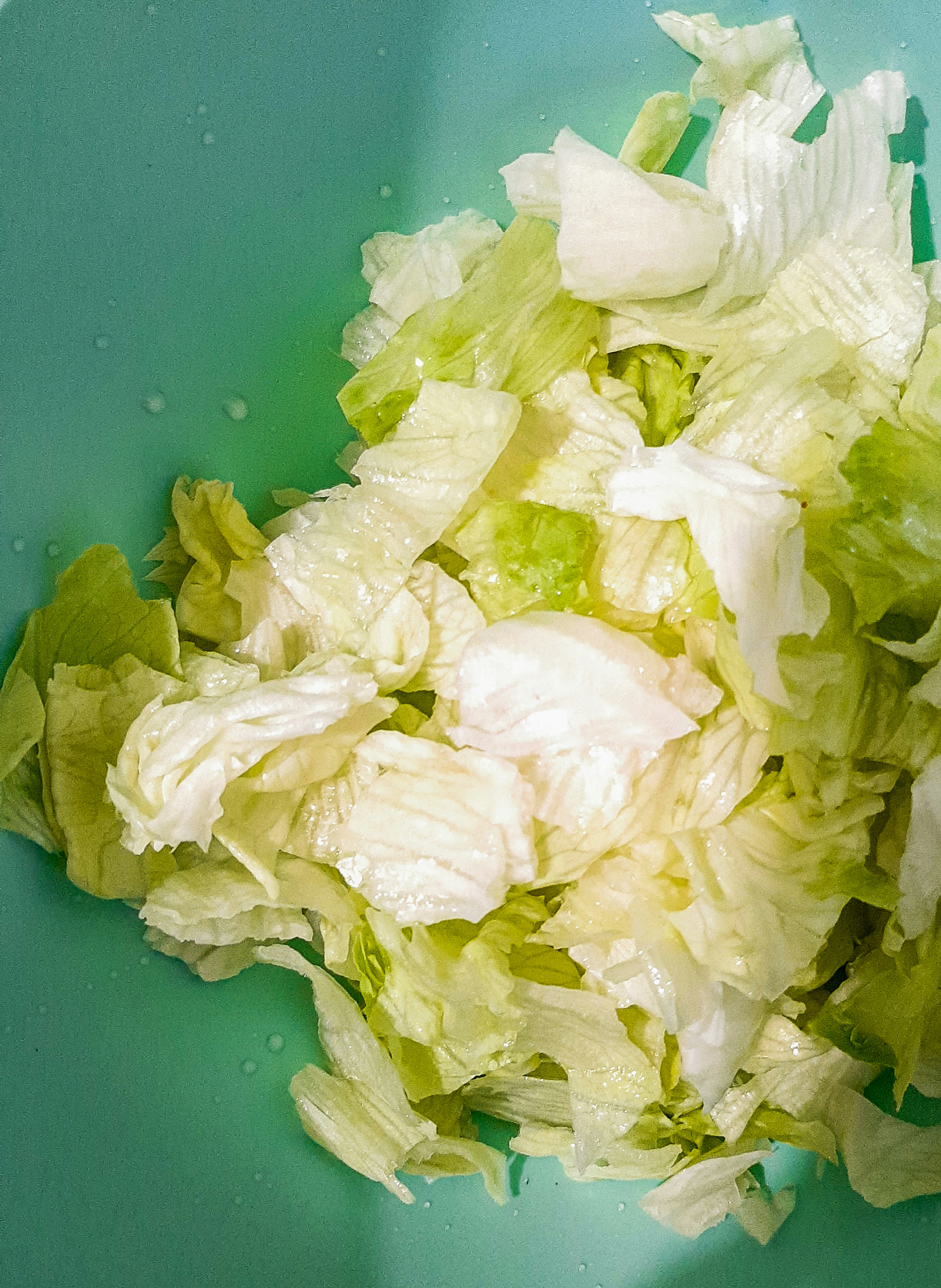 white tissue paper on green plastic container