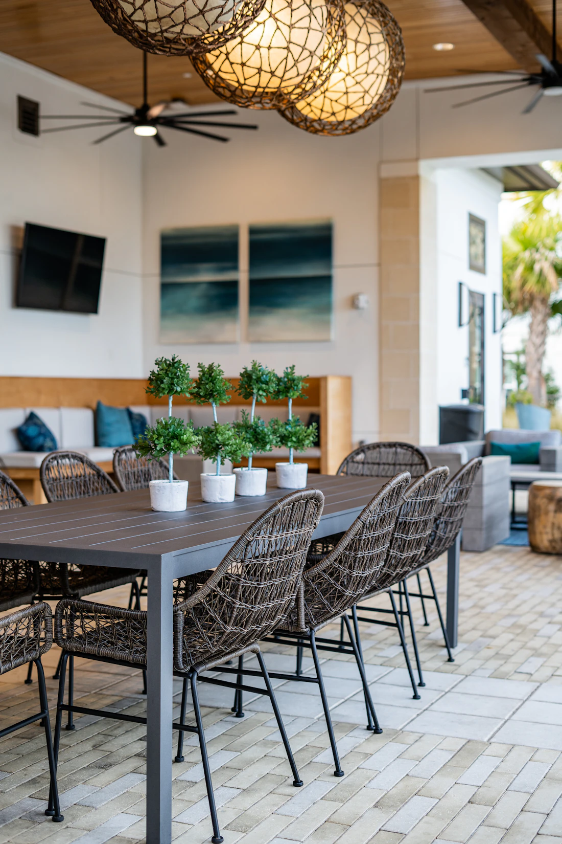 A black metal table and chairs set on the new dining terrace.