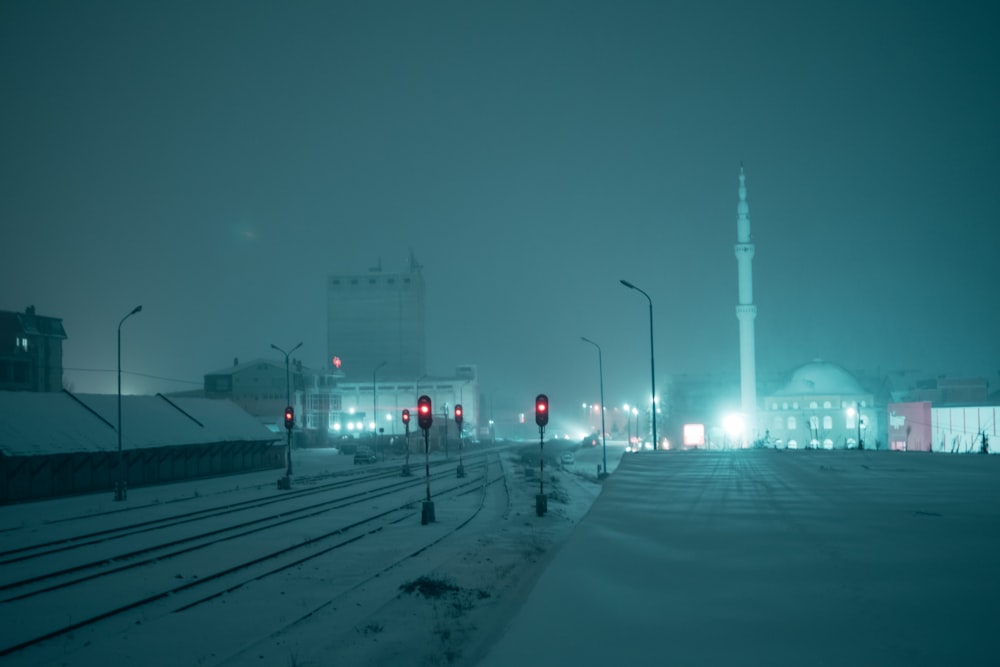 white tower near road during night time