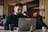 man in black crew neck shirt using macbook