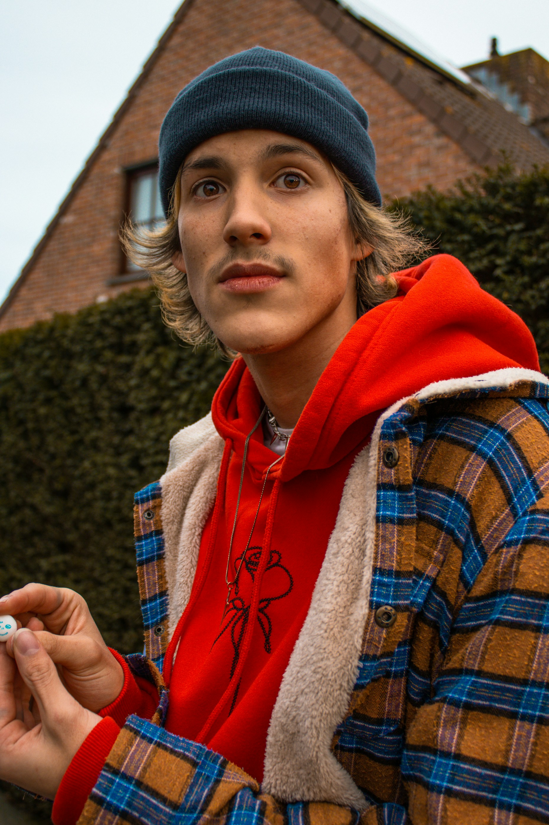 woman in red and white zip up hoodie